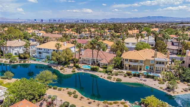 birds eye view of property with a water and mountain view and a residential view