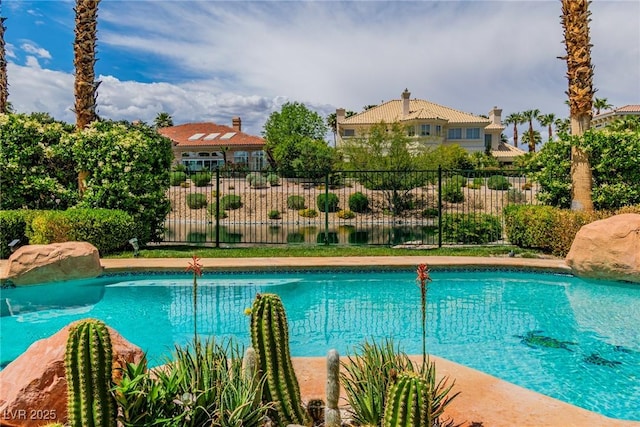 view of pool with fence and a fenced in pool