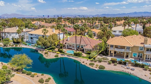 bird's eye view featuring a water and mountain view and a residential view