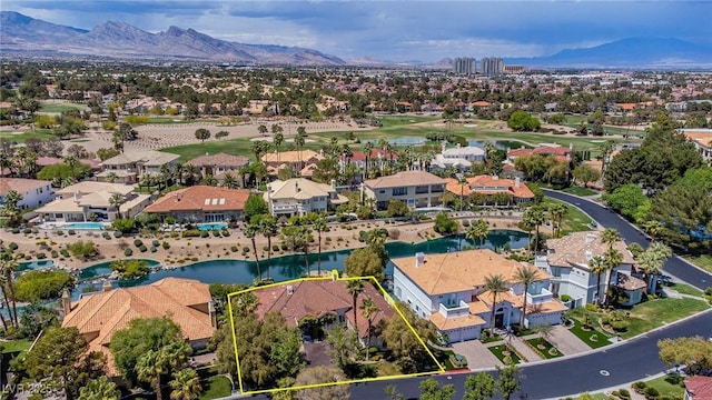 aerial view featuring a residential view and a water and mountain view