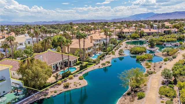 birds eye view of property with a residential view and a water and mountain view