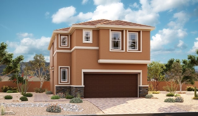 view of front facade featuring a garage, stucco siding, driveway, and stone siding