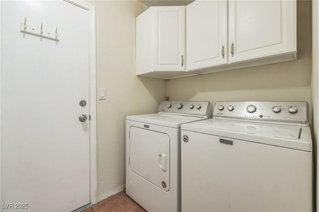 laundry room with washer and dryer, cabinet space, and light tile patterned floors