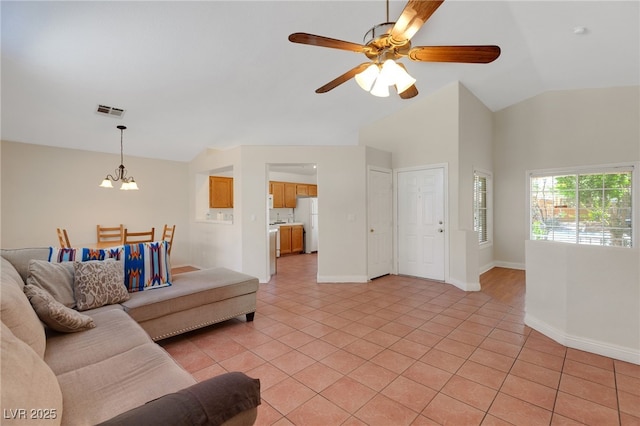 living room featuring a chandelier, light tile patterned floors, ceiling fan, high vaulted ceiling, and baseboards
