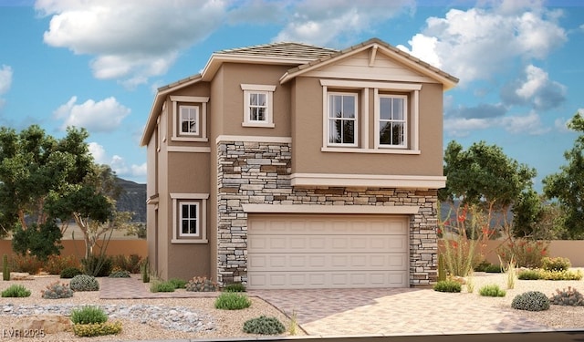 view of front of property with stucco siding, an attached garage, decorative driveway, and stone siding