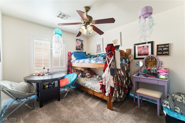carpeted bedroom with visible vents and a ceiling fan