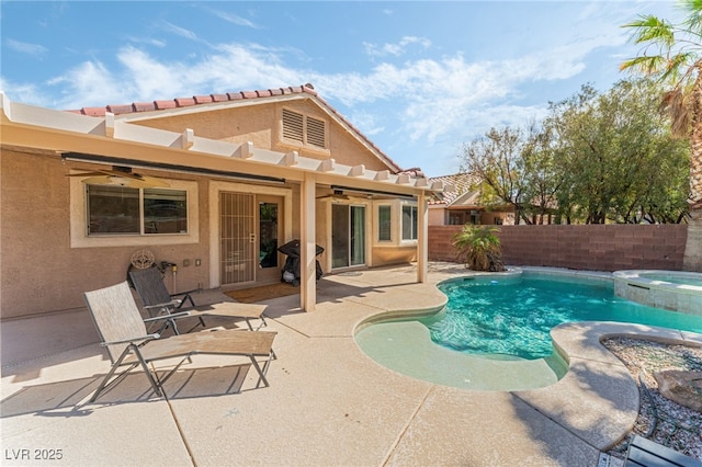view of pool with a ceiling fan, a patio area, a fenced backyard, and a pool with connected hot tub