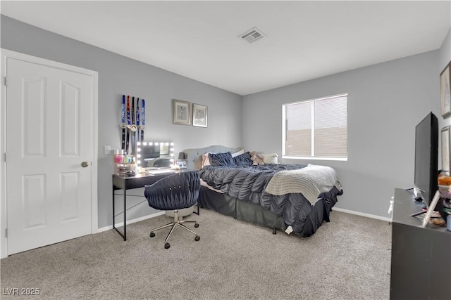 carpeted bedroom featuring baseboards and visible vents