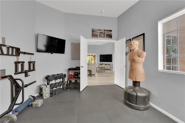 workout room with baseboards