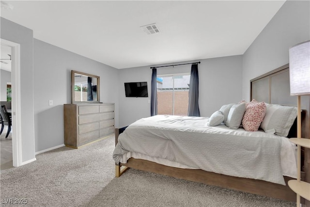 carpeted bedroom featuring baseboards and visible vents
