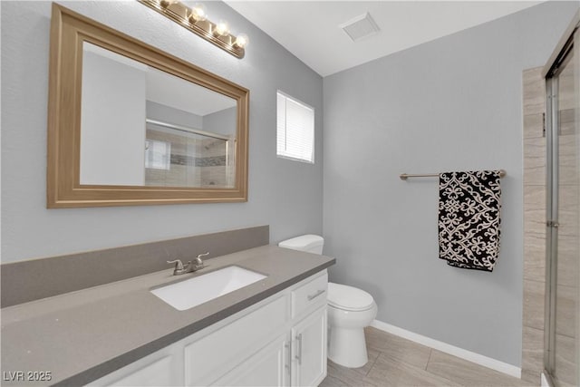 bathroom featuring toilet, visible vents, a tile shower, and vanity