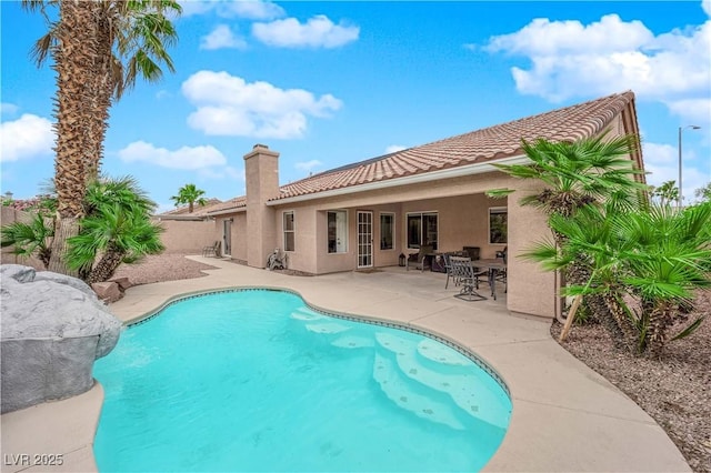 view of pool with a fenced in pool, fence, and a patio