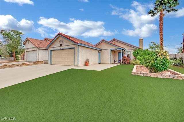 view of front of home featuring a garage, a front lawn, stucco siding, a tiled roof, and concrete driveway