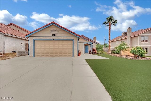 ranch-style home featuring an attached garage and driveway