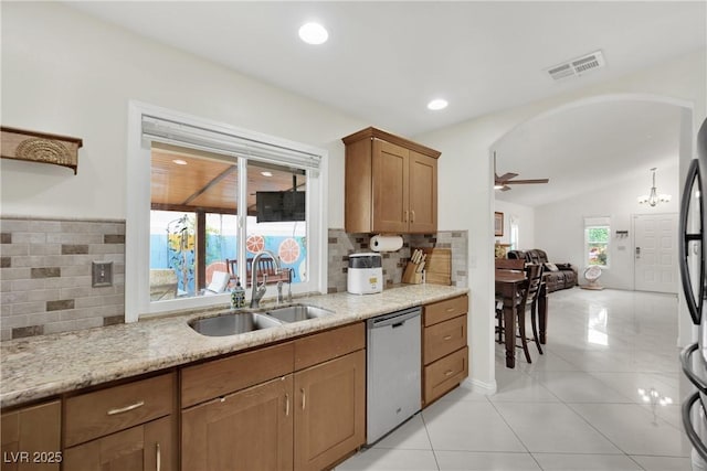 kitchen with visible vents, a sink, decorative backsplash, and stainless steel appliances