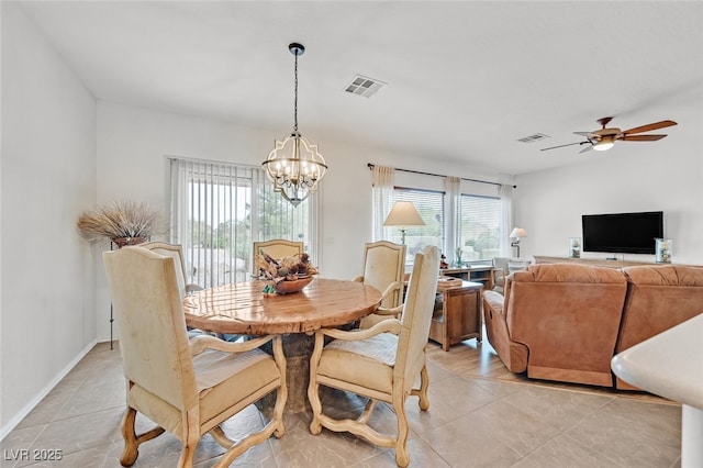 7908 House Sparrow St, North Las Vegas, NV 89084 - dining room featuring ceiling fan with notable chandelier, light tile patterned flooring, and visible vents