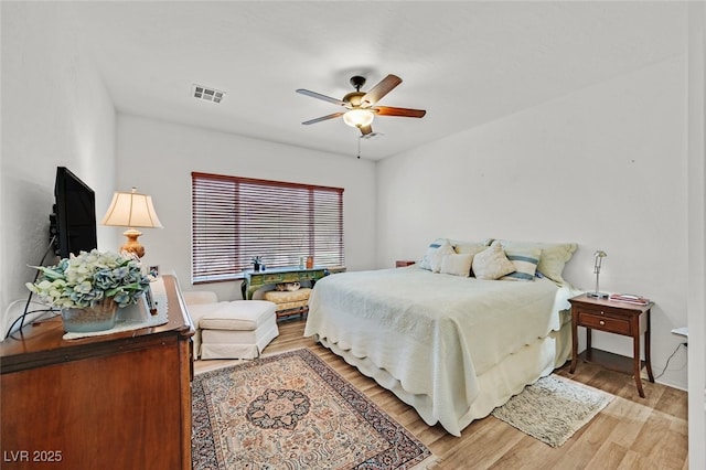 7908 House Sparrow St, North Las Vegas, NV 89084 - bedroom with visible vents, a ceiling fan, and light wood finished floors