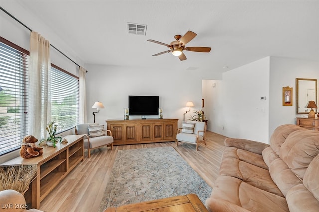 7908 House Sparrow St, North Las Vegas, NV 89084 - living area with a ceiling fan, light wood-style flooring, and visible vents