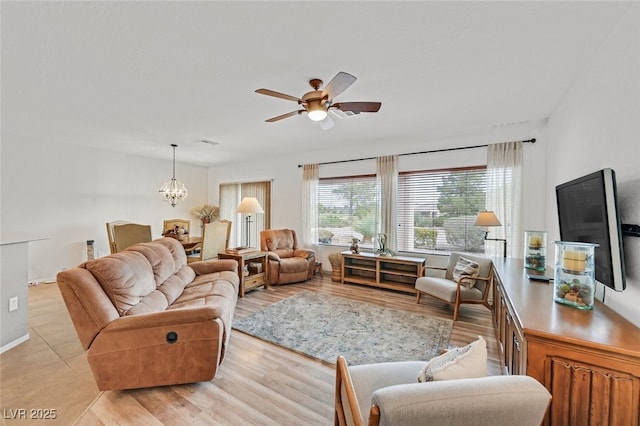 7908 House Sparrow St, North Las Vegas, NV 89084 - living area featuring visible vents, ceiling fan with notable chandelier, and light wood-type flooring