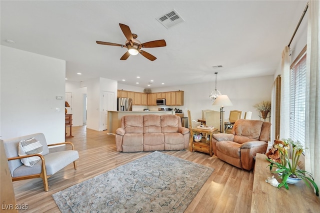 7908 House Sparrow St, North Las Vegas, NV 89084 - living room featuring recessed lighting, a ceiling fan, light wood-type flooring, and visible vents