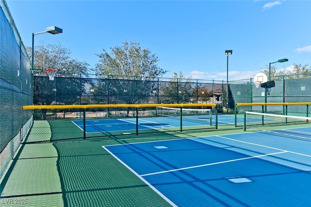 7908 House Sparrow St, North Las Vegas, NV 89084 - view of tennis court with community basketball court and fence
