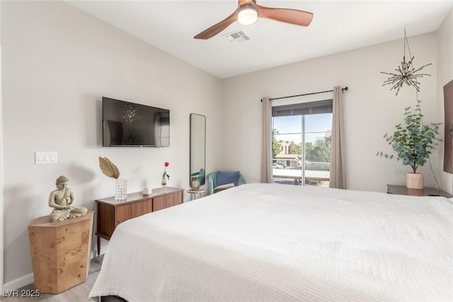 bedroom with a ceiling fan, access to exterior, visible vents, light wood-type flooring, and baseboards