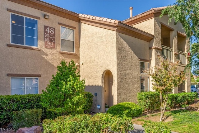 view of property exterior with stucco siding