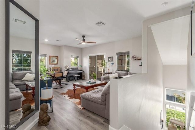 living room featuring visible vents, recessed lighting, ceiling fan, and wood finished floors
