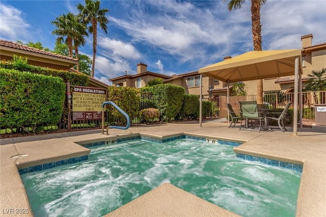 view of swimming pool with fence and a patio area