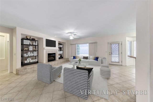 2056 Oliver Springs St, Henderson, NV 89052 - tiled living room featuring a ceiling fan, a fireplace, and built in features