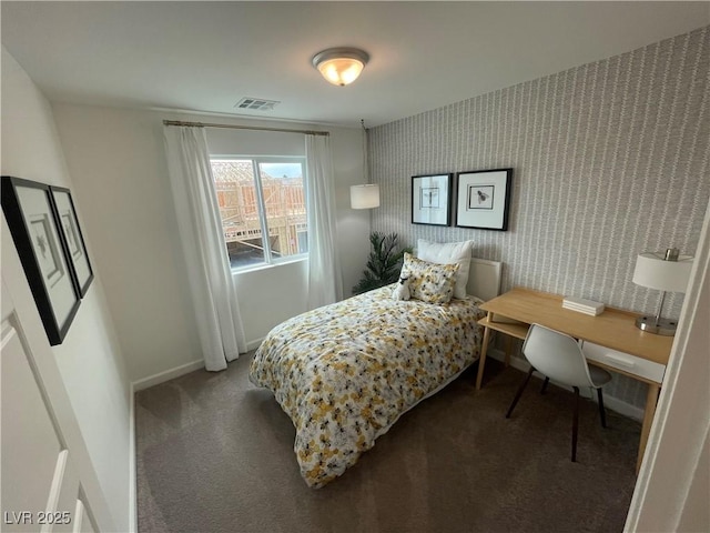 carpeted bedroom with baseboards, visible vents, and wallpapered walls