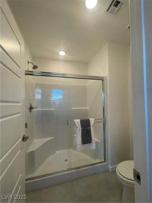 full bathroom with visible vents, toilet, recessed lighting, tile patterned floors, and a stall shower