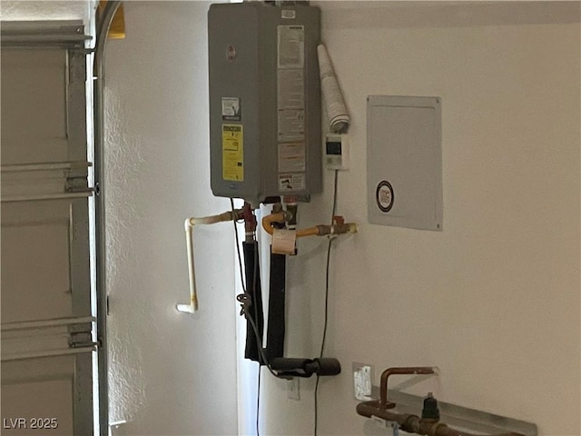 utility room with tankless water heater
