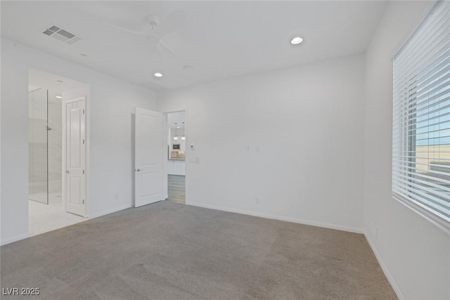 unfurnished bedroom with recessed lighting, visible vents, and light carpet