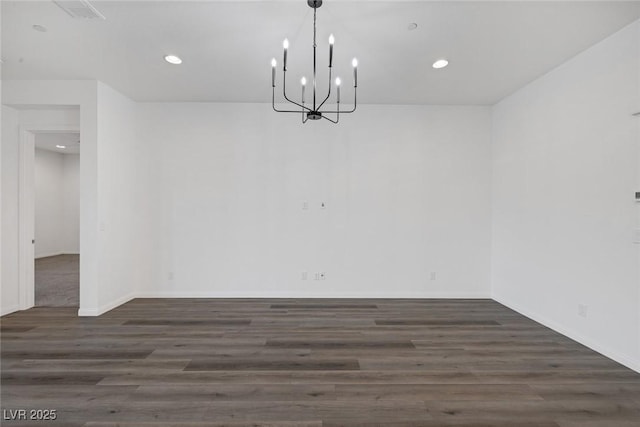 unfurnished dining area with a notable chandelier, recessed lighting, wood finished floors, and visible vents