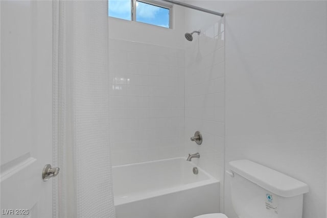 bathroom with toilet and shower / tub combo with curtain