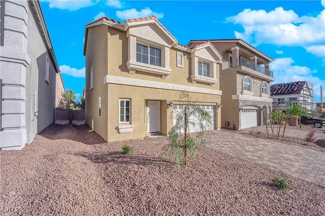 6142 Kelson Creek Ct, Las Vegas, NV 89118 - view of front of house with a garage, fence, decorative driveway, stucco siding, and a tiled roof