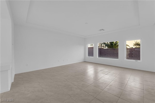6142 Kelson Creek Ct, Las Vegas, NV 89118 - empty room with light tile patterned flooring, visible vents, and a raised ceiling