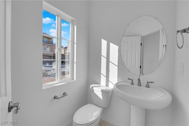 6142 Kelson Creek Ct, Las Vegas, NV 89118 - half bath with a sink, baseboards, plenty of natural light, and toilet
