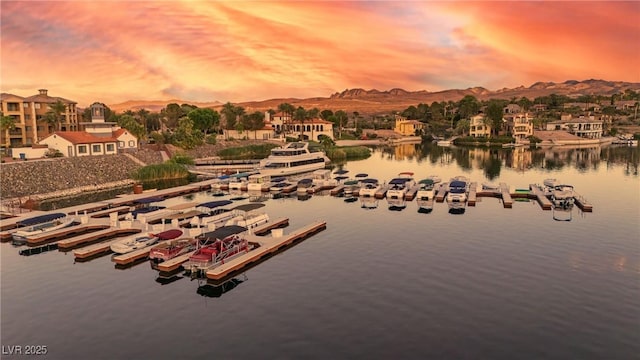 aerial view at dusk with a water and mountain view