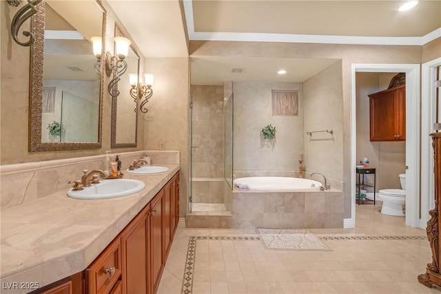 bathroom with a sink, tile patterned floors, and toilet