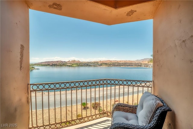balcony featuring a water view