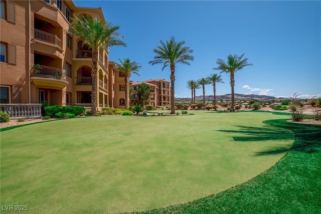 surrounding community with a mountain view