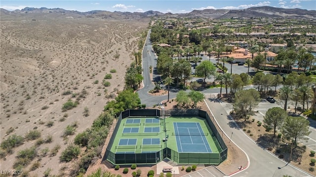 birds eye view of property with a mountain view