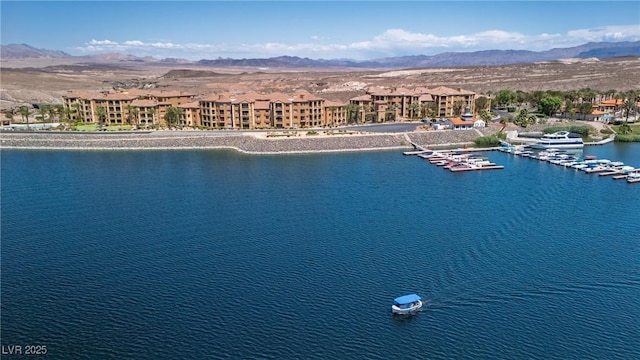 birds eye view of property featuring a water and mountain view