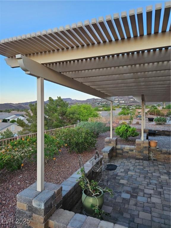 2110 King Mesa Dr, Henderson, NV 89012 - view of patio featuring a pergola, fence, and a mountain view