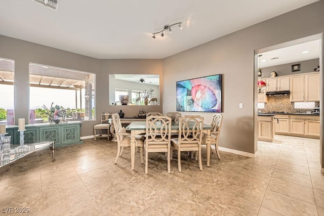 2110 King Mesa Dr, Henderson, NV 89012 - dining area featuring baseboards, light tile patterned flooring, a ceiling fan, and track lighting