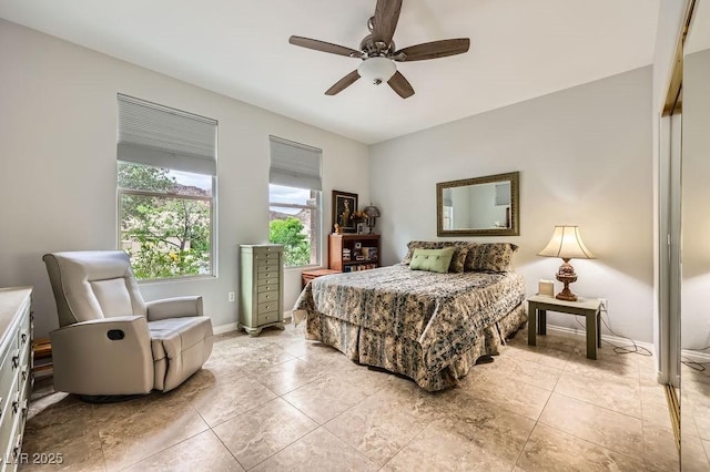 2110 King Mesa Dr, Henderson, NV 89012 - bedroom with ceiling fan, baseboards, and light tile patterned flooring