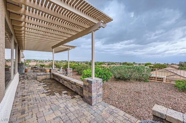 2110 King Mesa Dr, Henderson, NV 89012 - view of patio with a pergola and exterior kitchen