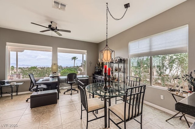 2110 King Mesa Dr, Henderson, NV 89012 - dining room with plenty of natural light, a ceiling fan, and baseboards
